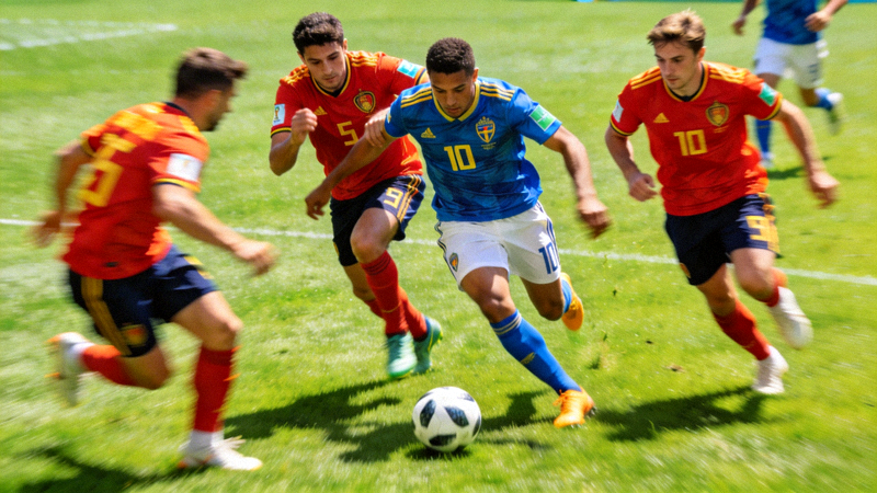 足球世界杯比赛中球队实施高位压迫战术的瞬间，多名前场球员围抢对方后卫